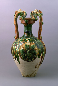 Three-color glazed vase with dragon handles and applied medallions.
