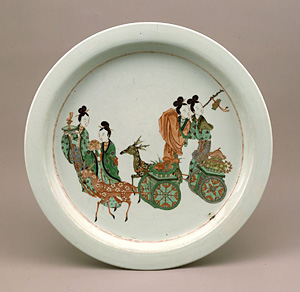 Dish with design of ladies and deer-drawn carts in overglaze enamels.