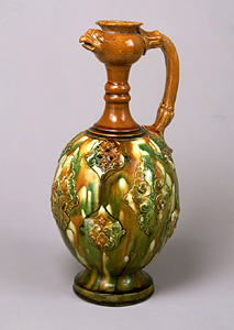 Three-color glazed phoenix-head ewer with applied ornaments.