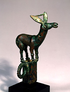 Pole top ornament in shape of animal.