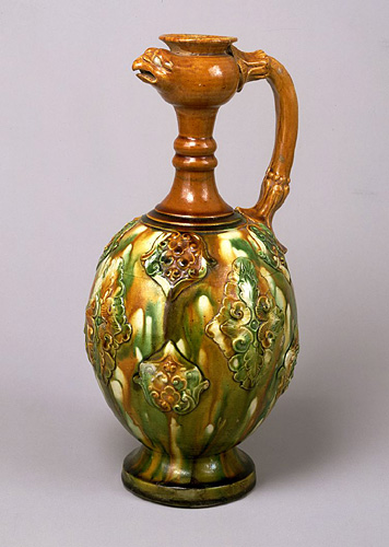 Three-color glazed phoenix-head ewer with applied ornaments.