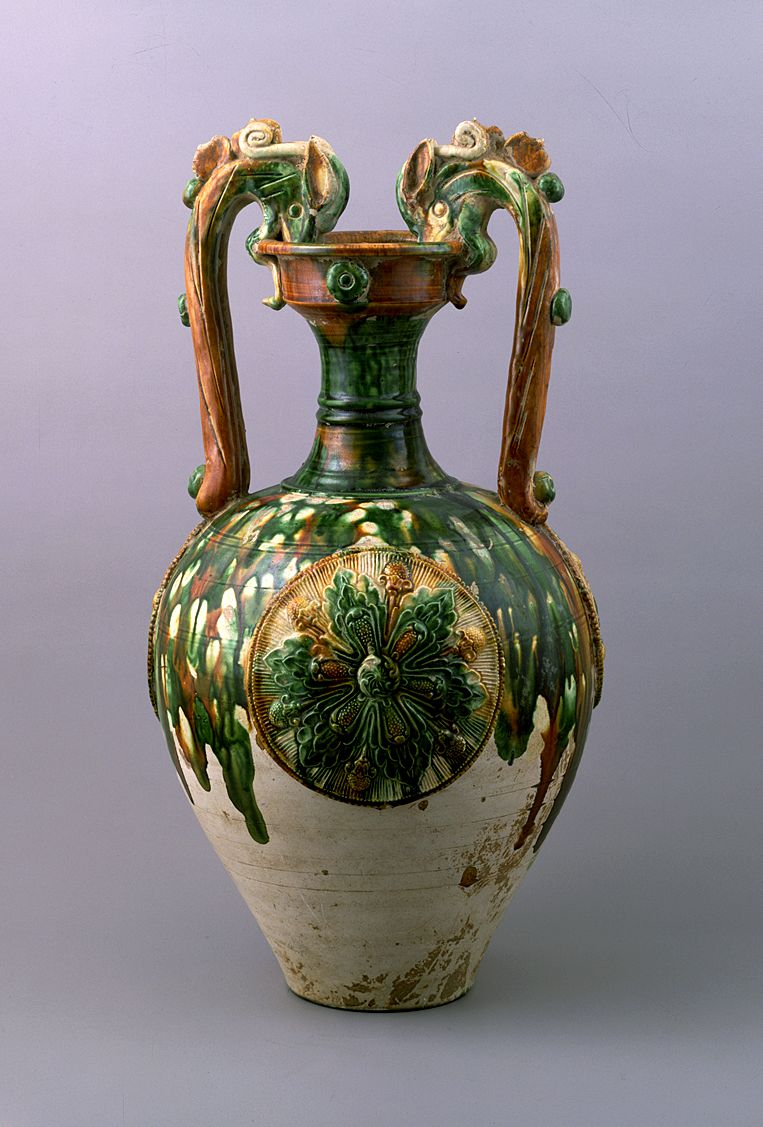 Three-color glazed vase with dragon handles and applied medallions.
