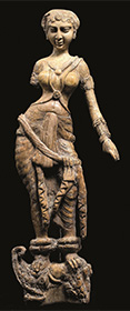 Woman standing on a makara
