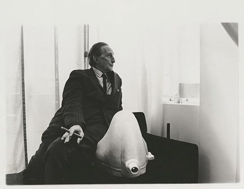 Duchamp Sitting by a Replica of Fountain