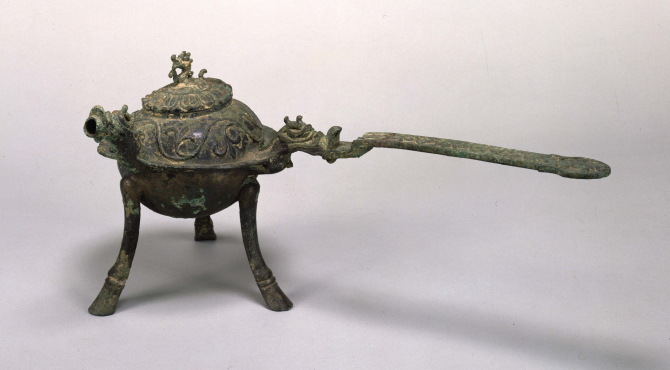 Image of "Three legged pot with handle, bronze."