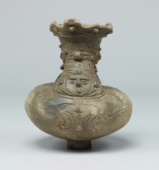 Image of "Spouted vessel with human figure decorations."