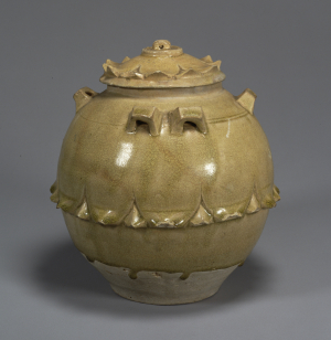 Image of "Celadon glazed jar with six handles and design of lotus petals."