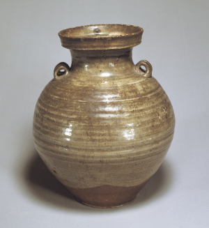 Image of "Celadon glazed jar with foru handles."