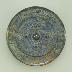 Image of "Bronze mirror with design of divinities and dragons."