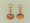 Image of "2 pairs of gold earrings."