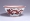 Image of "White porcelain bowl with dragon design in red glaze."