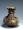 Image of "Spouted vessel with human figure decorations."
