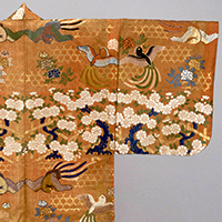 Image of "Karaori Garment (Noh Costume), Basket pattern, peony, cherry blossom and blue magpie design on red ground, Edo period, 18th century"