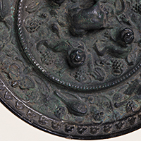 Image of "Mirror, Animal and Grape design, From Nishi Kuruno-cho, Gojyo-shi, Nara, Kofun period, 7th century"