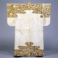 Image of "Nuihaku Garment(Noh Costume), Design of paulownias, phoenixes, reeds, cherry blossoms and snow-coverd bamboo at shoulders and skirts on white ground, Azuchi-Momoyama period, 16th century (Important Cultural Property)"