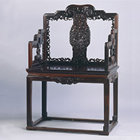 Image of "Chair, Carved flower and bat design, Qing dynasty, 18th century (Lent by the Shanghai Museum)"