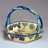 Image of "Bowl with Arched Handle, Cherry blossom design in overglaze enamel and openwork, Kyoto ware, Edo period, 18th century"