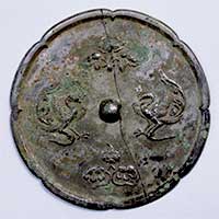 Image of "Ritual Objects Used to Consecrate Site of Kohfukuji Temple, Eight-lobed Mirror with Design of Auspicious Flowers and Paired Phoenixes, Excavated from under altar of Main Hall at Kohfukuji, Nara, Tang dynasty, 8th century (National Treasure)"