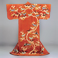 Image of "Kosode (Garment with small wrist openings), Design of paulownias and phoenixes on a red figured-satin ground, Formerly passed down by retainers of the Kurume domain, Edo period, 18th century"