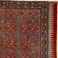 Image of "Chintz with reversible design, Knot and interlocking check design on madder red ground (detail), Coromandel Coast, southern India, Early 18th century"