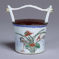 Image of "Tea Caddy in the Shape of a Pail with Lotuses and Herons, Jingdezhen ware, China; Nankin akae type, Passed down by the Konoike family, Ming-Qing dynasty, 17th century (Gift of Mr. Hirota Matsushige)"