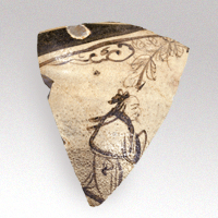 Image of "Shards of a Jar, Transparent glaze on white slip with figure and flowering plant design in underglaze iron pigment, Excavated on the premises of The University of Tokyo, Bunkyo-ku, Tokyo, Edo period, 17th-18th century (Yuan dynasty, 14th century), "