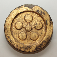 Image of "Round Eave Tile with Gold Leaf, With plum brossom crest, From Yuraku-cho, Chiyoda-ku, Tokyo, Edo period, 17th century"