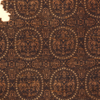 Image of "Cloth, With paired phoenixes and bead roundels design on brown ground (detail), Asuka-Nara period, 7th-8th century"