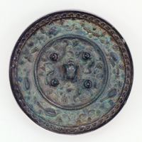 Image of "Mirror with Sea Beasts and Grapes, Found at Matsuyama Tumulus, Nara, Kofun period, 7th century"