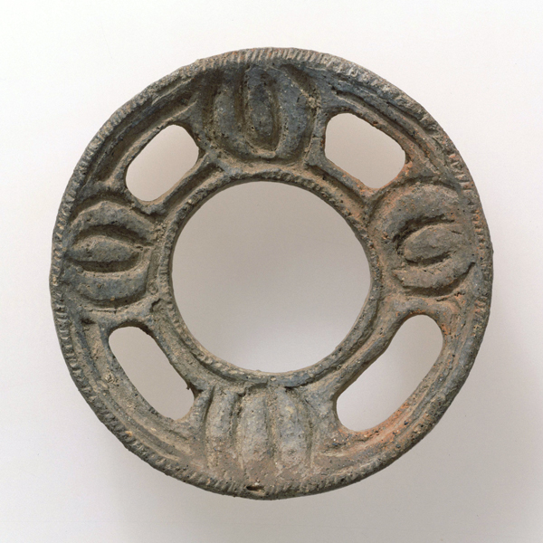 Image of "Clay Earring, Jomon period, 2000-400 BC, Excavated at Nakatakase, Akiruno-shi, Tokyo, Gift of Mr. Shiono Hanjuro"