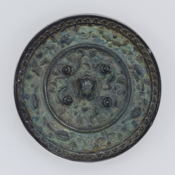 Image of "Mirror with Sea Beasts and Grapes, Found at Matsuyama Tumulus, Nara, Kofun period, 7th century"