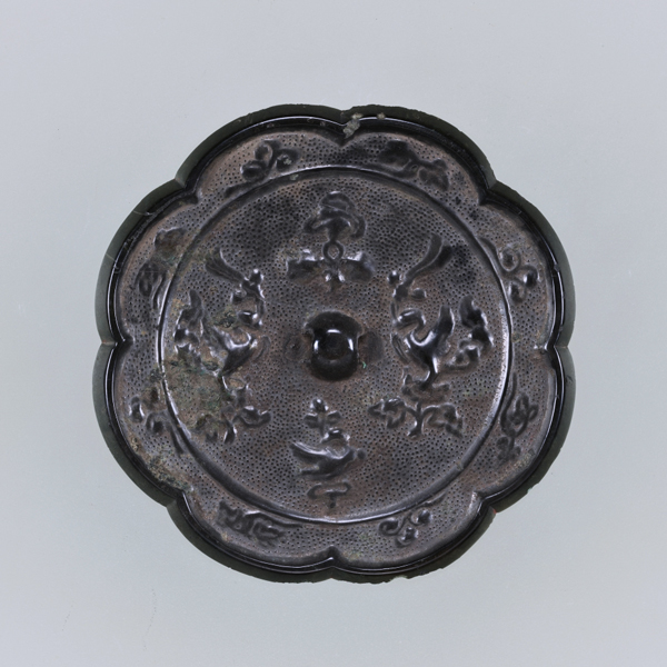 Image of "Eight-Lobed Mirror with Auspicious Flowers and Paired Mythical Birds (Luan), Found on the peak of Mount Tsubato, Ōita, Nara period, 8th century"